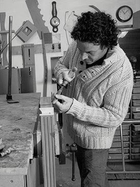 Darren Flintoff working on a piece of furniture in his workshop